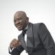 Confident portrait of a smiling black man in a classic tuxedo.